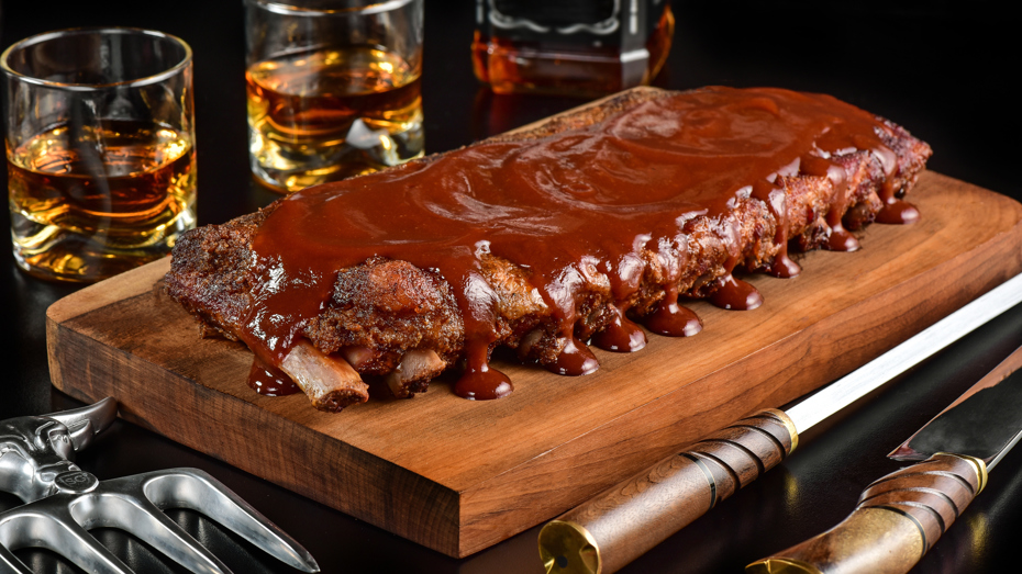 A bourbon-based barbecue sauce can create a seamless flavor link between your drink and your meal