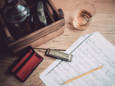Bourbon finds a natural place within the lyrics, embodying the soul and depth of the blues.