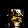 Adding ice to bourbon does more than just chill it; it dilutes the spirit as the ice melts.